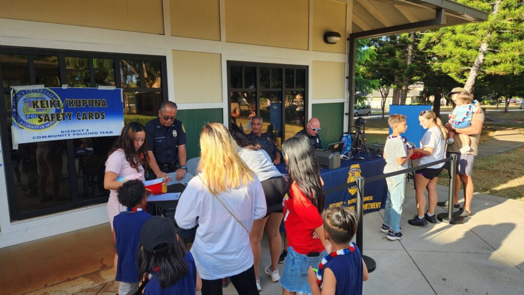 Officers taking Keiki ID for event