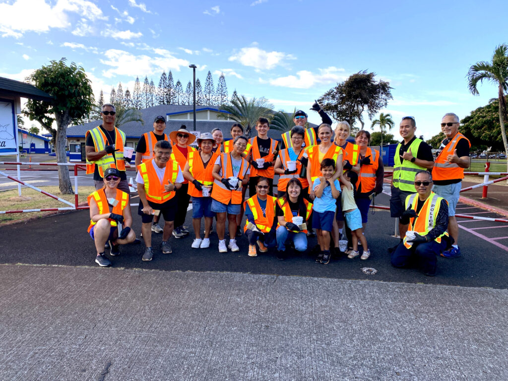 Officers and community members painted over graffiti in the lower Mililani area.