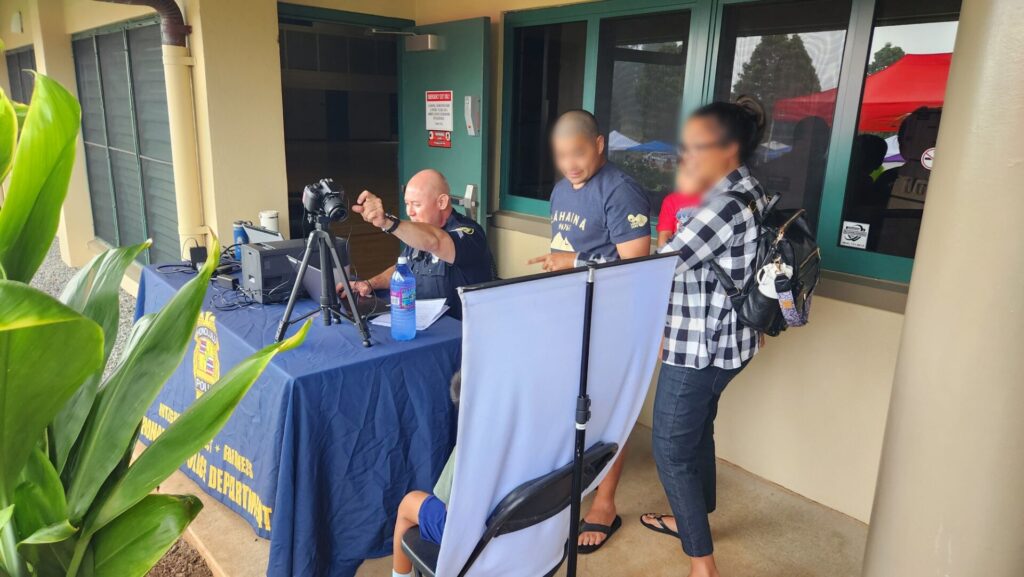 Officers providing free Keiki ID to community members