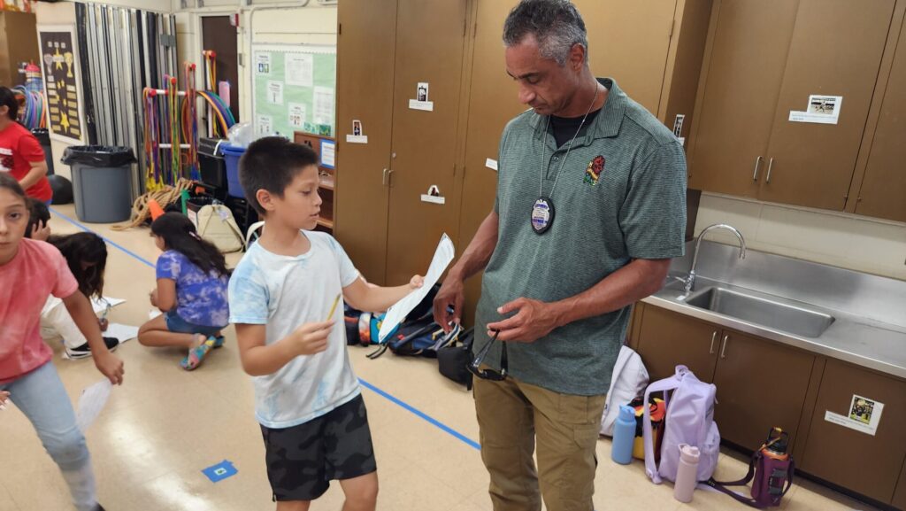 Officers mentoring students at the campus police officer program