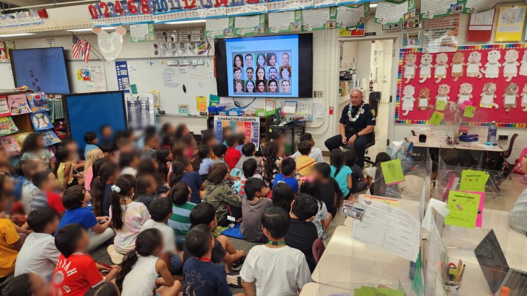 Officers teaching students about stranger danger