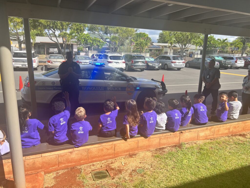 Officers showing students the police vehicle