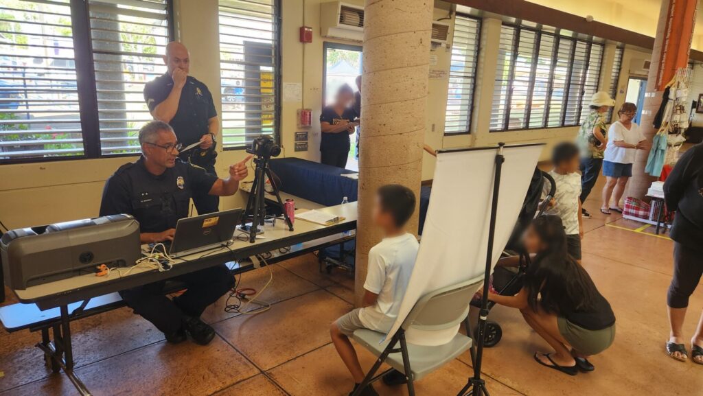 Officers provided free keiki id to kids at the Mililani Mauka Fair