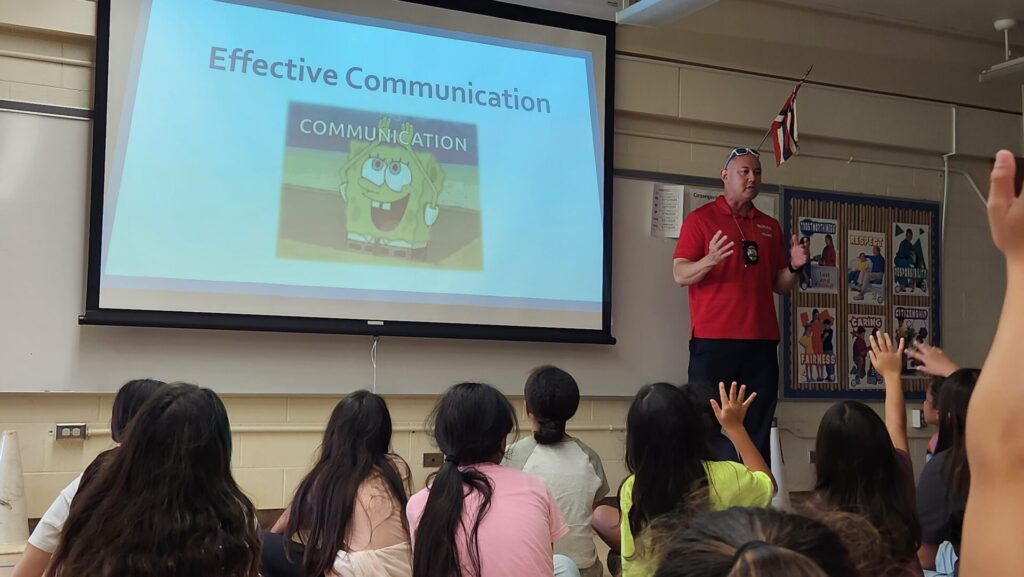 Officers teaching kids from CPO program