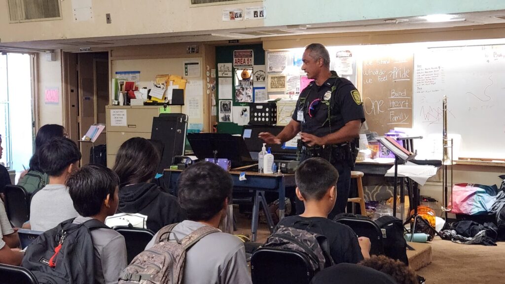 Officer educating students on what police do