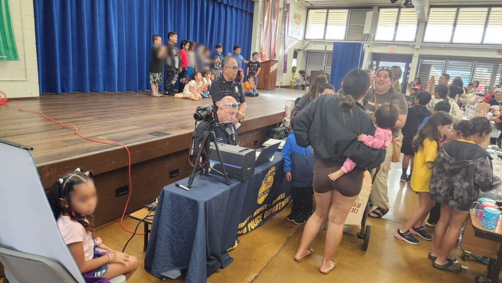 Officers making Keiki ID for students