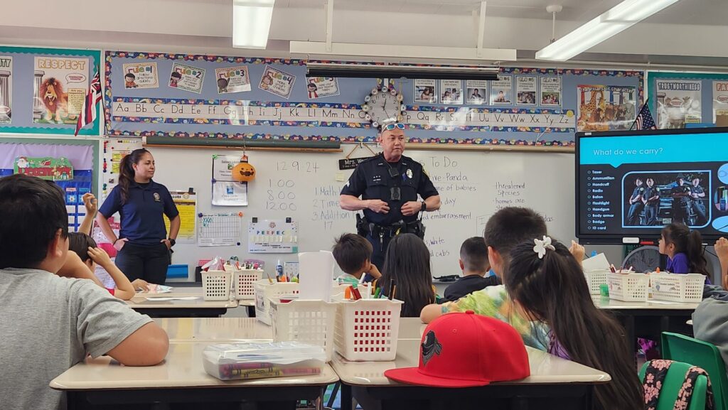 Officers telling students about what officers do