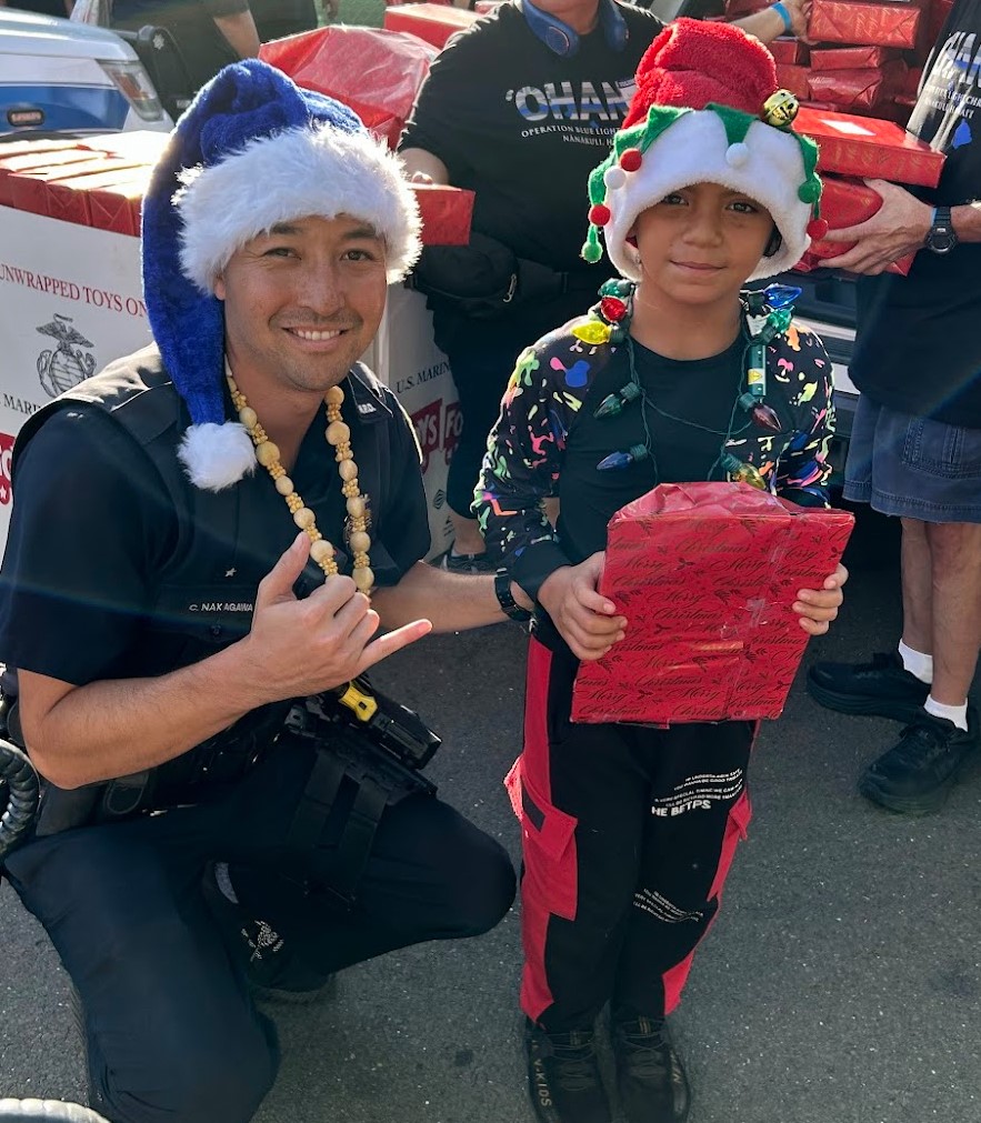 CPT Officer Nakagawa with participant of Blue Light Christmas