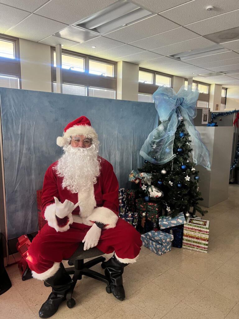 Santa at the end of D8 Christmas Lane ready to pass out presents