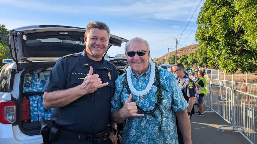 HPD Captain Beckley and Mayor Blangiardi at Operation Blue Light Christmas Event