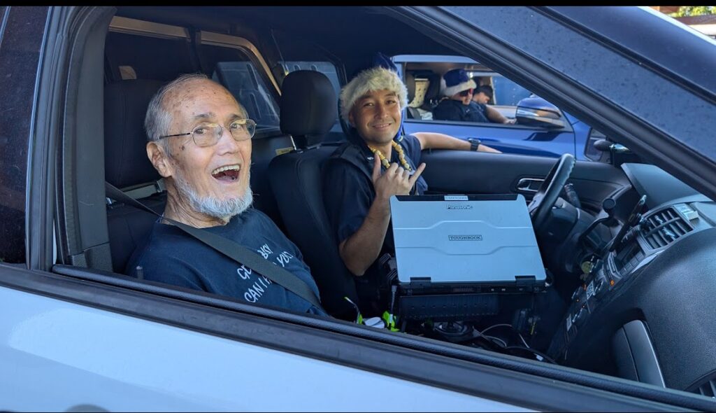 CPT Officer Nakagawa and Retired HPD Major Hama getting ready to head out to Operation Blue Light Christmas